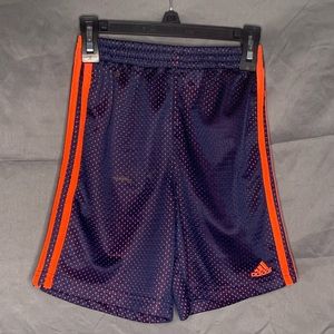 Orange and navy Adidas shorts.